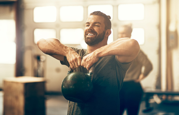 Magnuson Athletic Club member lifting dumbbell